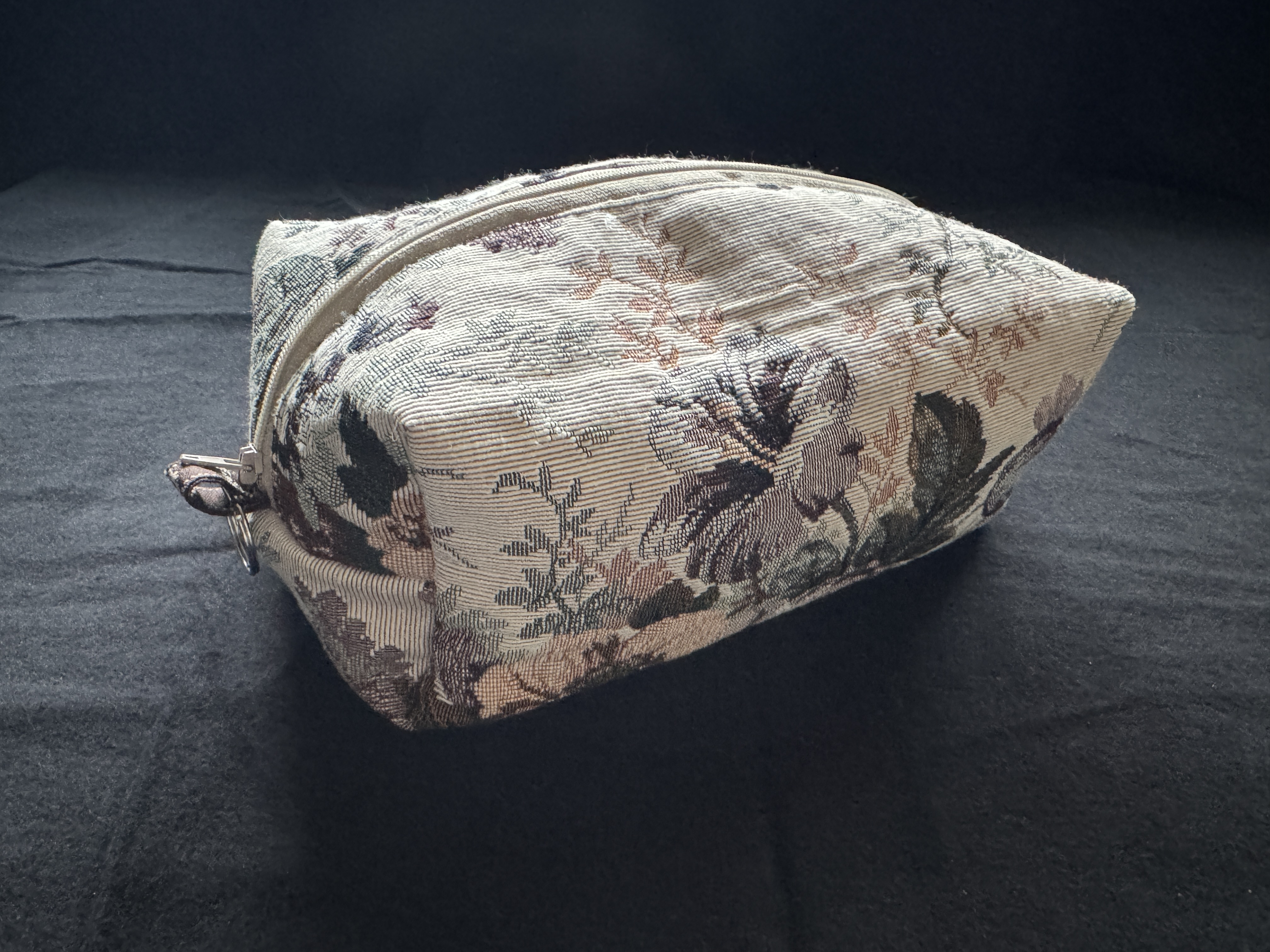 Elegant light colored floral tapestry cosmetic makeup bag